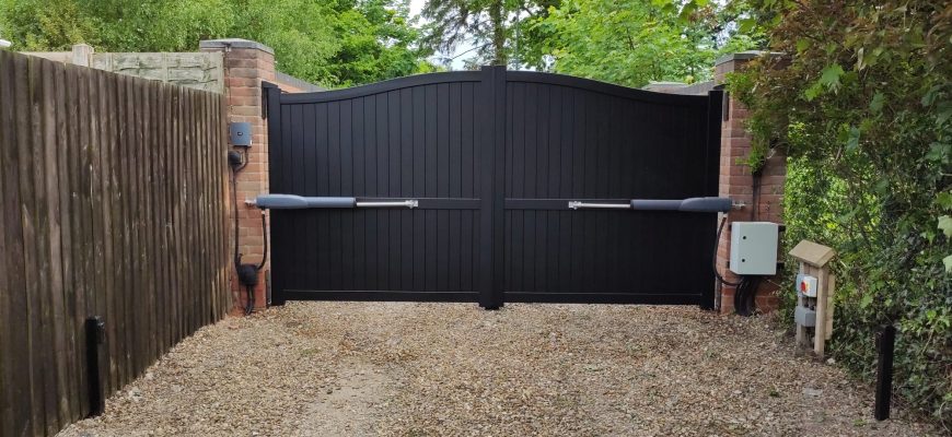 aluminium gate with bell curved top and RAM automation installed by henderson on the wirral cheshire
