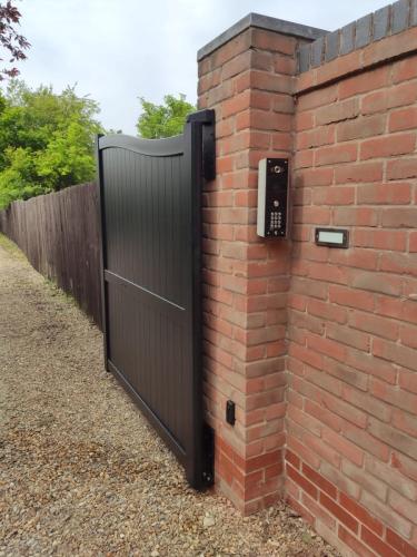 Aluminium gate with intercom installed by henderson on the wirral cheshire