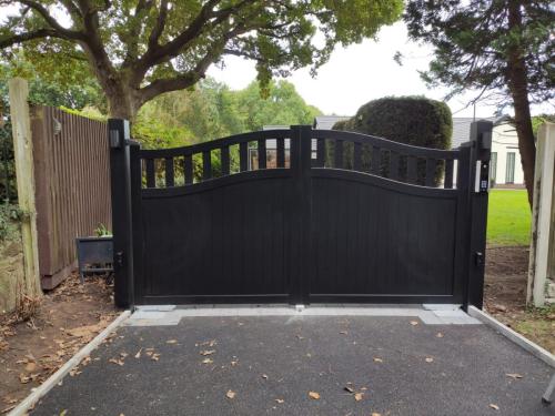Bell curved top aluminium gate with open infill installed by henderson in neston