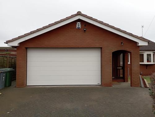 Insulated Sectional Garage door in White installed by Henderson on the Wirral