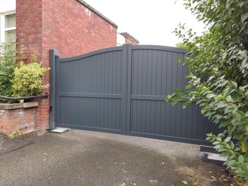 external view of bell curved top gate with underground automation installed by henderson in cheshire